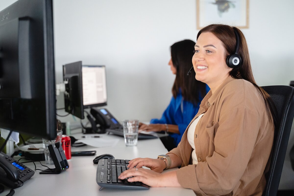 PolicyBee's Lauren talking to a customer over the phone