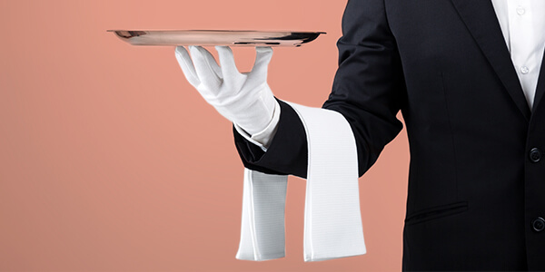 The value of service - a butler with a serving plate
