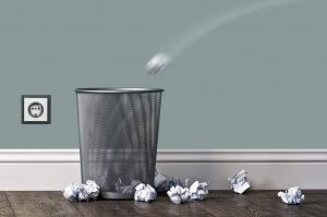 Paper thrown into a metal bin_Image used under license from Shutterstock