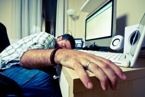 Creative Commons man sleeping at a desk by reynermedia_Flickr Creative Commons man sleeping at a desk by reynermedia_Flickr