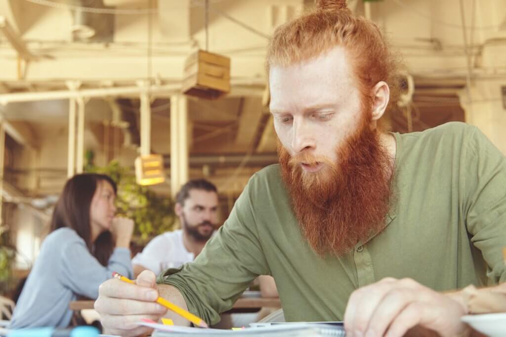 Man with beard studying_Image used under license from Shutterstock