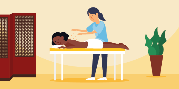 woman receiving reiki massage