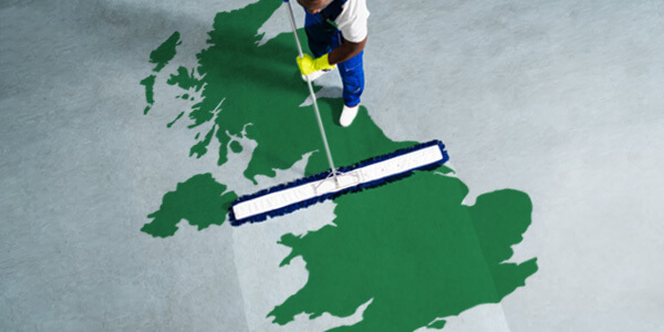 Man cleaning a map of the UK