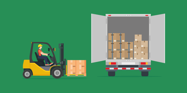 A forklift loads vital goods into a lorry, which can be protected with stock insurance.